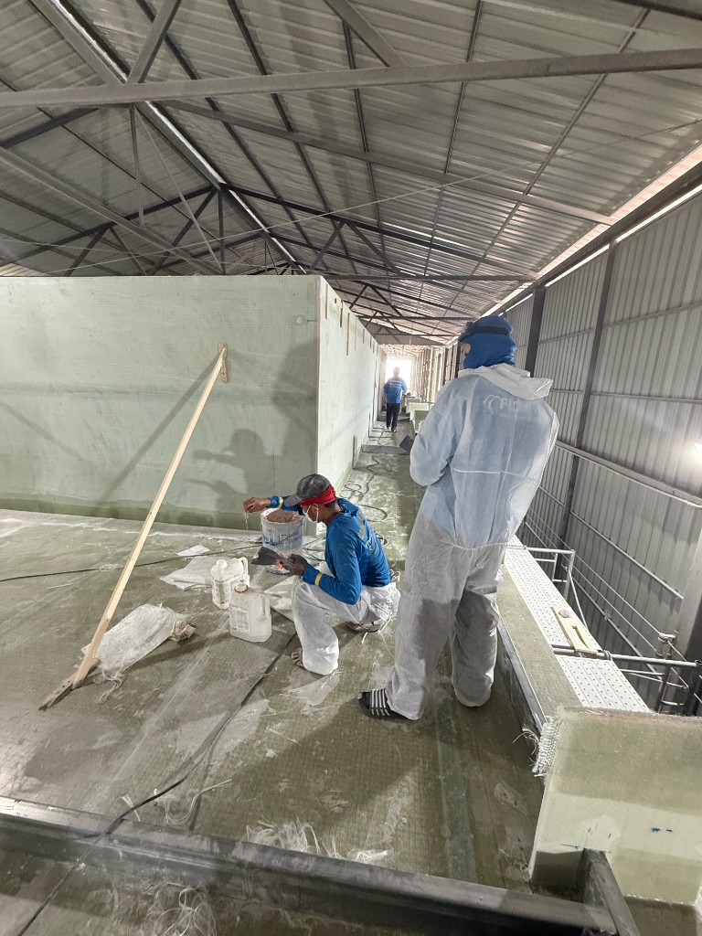 Shipyard team working on fiberglass deck structure